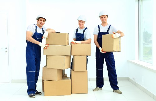 Fragile household items being packed safely for transport in Brentcross