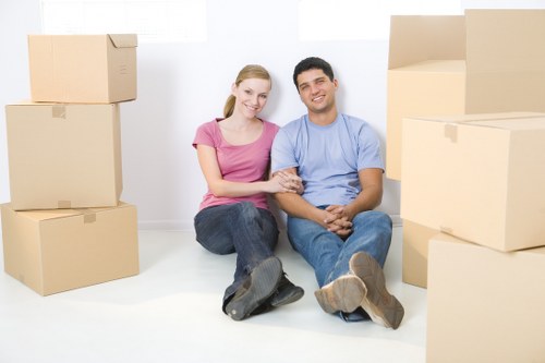 Worker using protective equipment while handling boxes