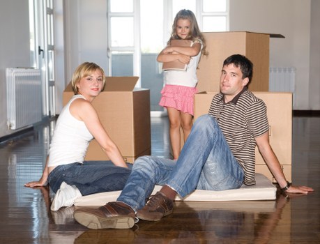 Loading household items into a van for a Brentcross relocation